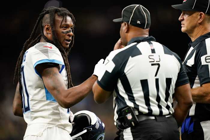Tennessee Titans wide receiver DeAndre Hopkins (10) disputes a call with side judge Keith Washington (7) against the New Orleans Saints at Caesars Superdome.